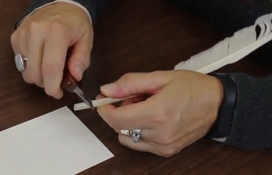 Moving image of cutting the tip of a feather quill